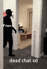 a silhouette of a man standing in a hallway with the words dead chat xd