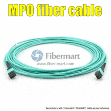 a spool of mpo fiber cable on a white surface .