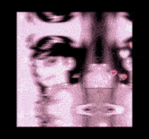 a blurred image of a person 's face with hearts around them