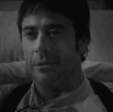 a close up of a man 's face with his eyes closed