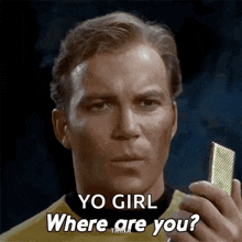 a man is holding a microphone in his hand and asking where are you .