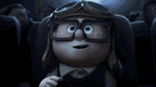 a cartoon character is wearing goggles and glasses while watching a movie .