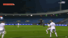 a soccer game is being played in a stadium and the score is 0-0