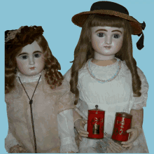 two dolls are standing next to each other and one is holding a red can that says ' earl grey tea '
