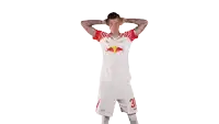 a man wearing a red bull jersey and shorts with the number 30