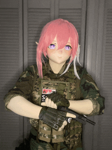 a girl in a military uniform holds a gun