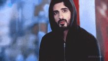 a man with a beard is wearing a black hoodie with the word miyasalma on the bottom