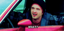 a man is driving a pink car and asking what