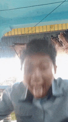 a man making a funny face with his tongue hanging out