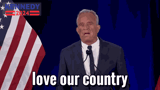 a man in a suit and tie is giving a speech with the words love our country in front of an american flag