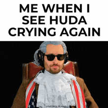 a man wearing a wig and sunglasses sits in a chair with the words " me when i see huda crying again "