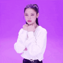 a girl with purple hair is wearing a white shirt