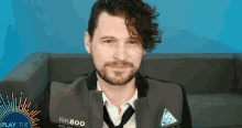 a man with a beard wears a jacket that says rk800 on it