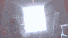 a room with a light shining through a door
