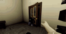 a person 's hand is reaching out to open a door in a video game with a percentage of 93 %