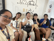 a girl wearing a lanyard that says bga on it poses for a photo
