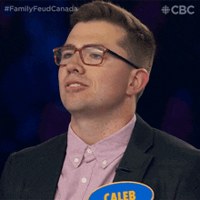 a man wearing glasses and a name tag that says caleb on it