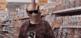 a man wearing sunglasses and a shirt that says ' lower prices ' on it