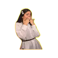 a woman wearing a white shirt and a black belt covering her mouth with her hands