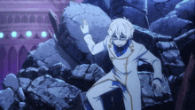 a man in a white suit stands in a pile of rocks
