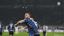 a soccer player with the number 8 on his jersey is celebrating