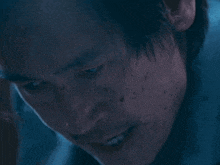 a close up of a man 's face with spots on his face