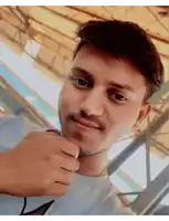 a man with a beard and a white shirt has his fist up