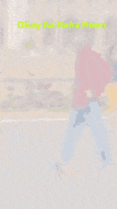 a blurry picture of a man walking with the words okay aa raha hoon written in green