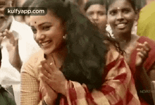 action heroines clapping hands staring at someone nithya menen