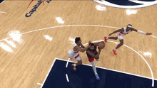 a basketball game is being played on a court with a player wearing a white jersey with the number 23 on it