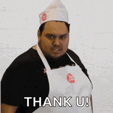 a man wearing a chef 's hat and apron is saying thank u .
