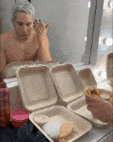 a man applying makeup in front of a mirror with a bottle that says 5t26