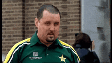 a man wearing a green and yellow shirt that says ' icc cricket world cup ' on it
