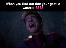 a man in a spider-man suit is laughing with a broken heart in the background