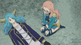 a woman kneeling next to a man with horns