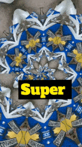 a blue and white kaleidoscope with the word super in the middle