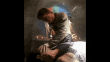 a man is examining a body wrapped in plastic while a woman looks on