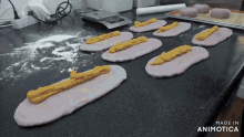 a bunch of dough on a counter that says made in animotica on it