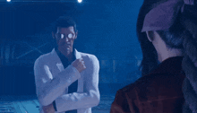 a man with glasses and a ponytail is standing next to a woman