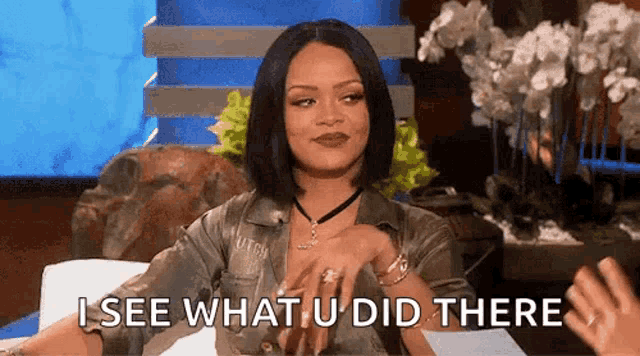 a woman is sitting on a couch and saying i see what you did there .