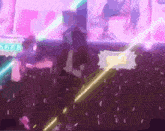 a blurry picture of a crowd at a concert with purple lights and a purple background