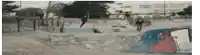 a skateboarder is doing a trick in a skatepark