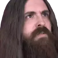 a man with long hair and a beard is making a face