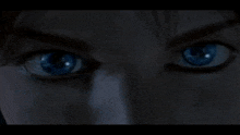 a close up of a person 's eyes with blue eyes