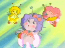 a cartoon drawing of three fairy dolls one of which is purple