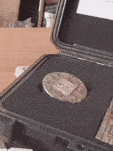a coin with the word gps on it is in a case