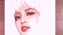 a person is drawing a woman 's face with a pencil on a piece of paper .