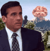 a man in a suit stands in front of an explosion