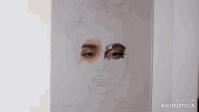 a person is painting a woman 's face with a brush on a canvas .