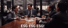 a group of men are sitting around a table with the words esg esg esg written on the screen